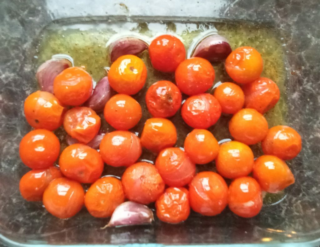 A picture of the roasted cherry tomatoes and garlic ready to make the pasta